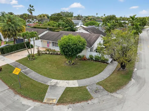 a living room with furniture rug and a window