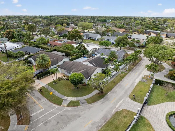 a living room with furniture a rug and a large window