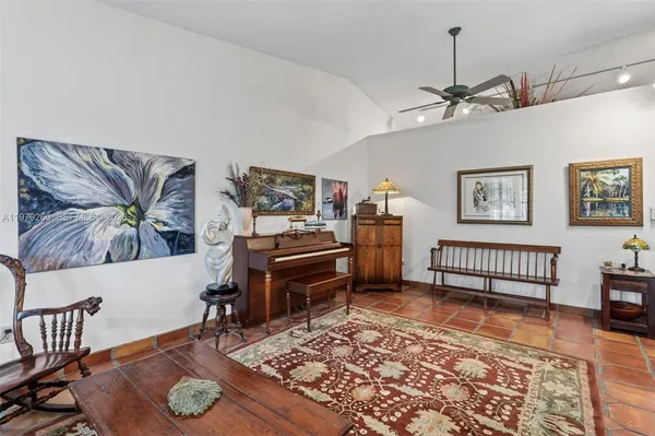 a bathroom with a granite countertop sink toilet a mirror and shower