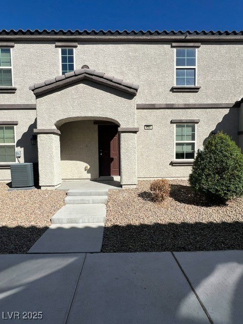 4561 Woolcomber Street Las Vegas, NV 89115 - Photo 2 of 19 Property entrance featuring stucco siding