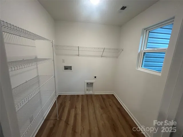 a view of a room with racks on the wall