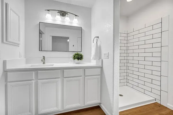 a bathroom with a sink and a mirror