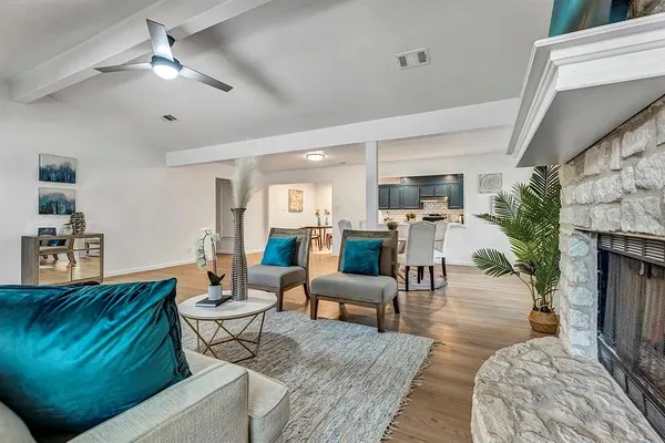 a living room with furniture and a fireplace