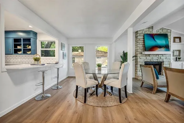 a view of a dining room with furniture window and outside view