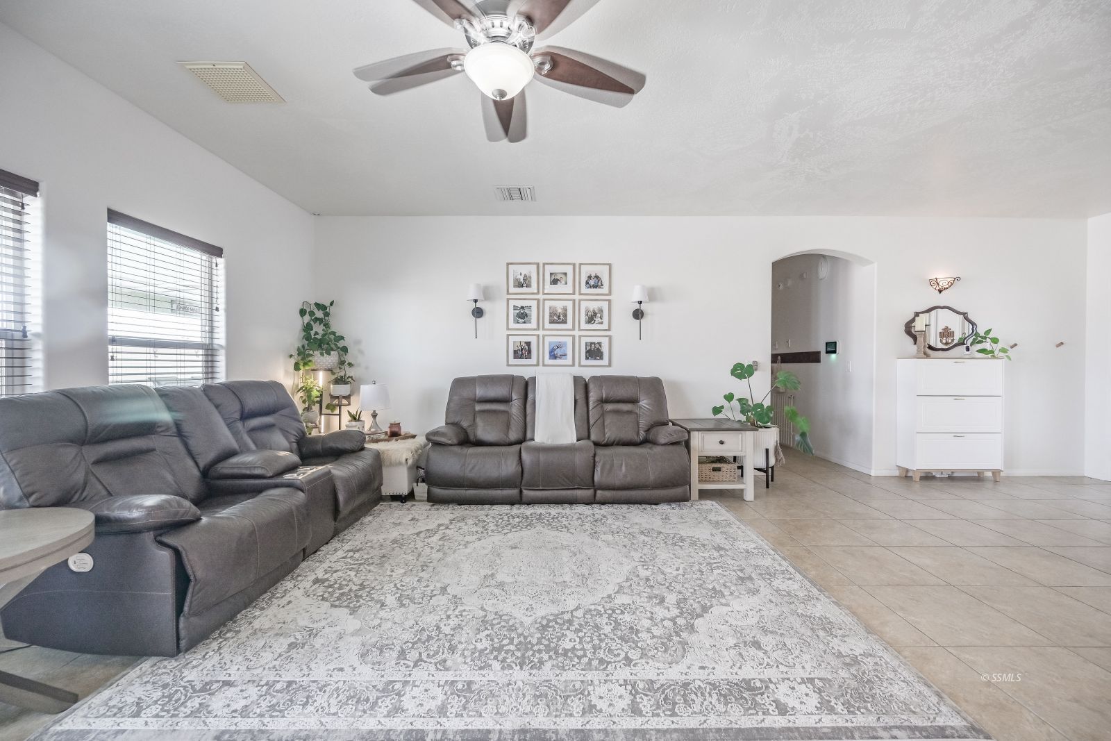 400 Acacia Street Ridgecrest, CA 93555 - Photo 18 of 45 a living room with furniture and a chandelier