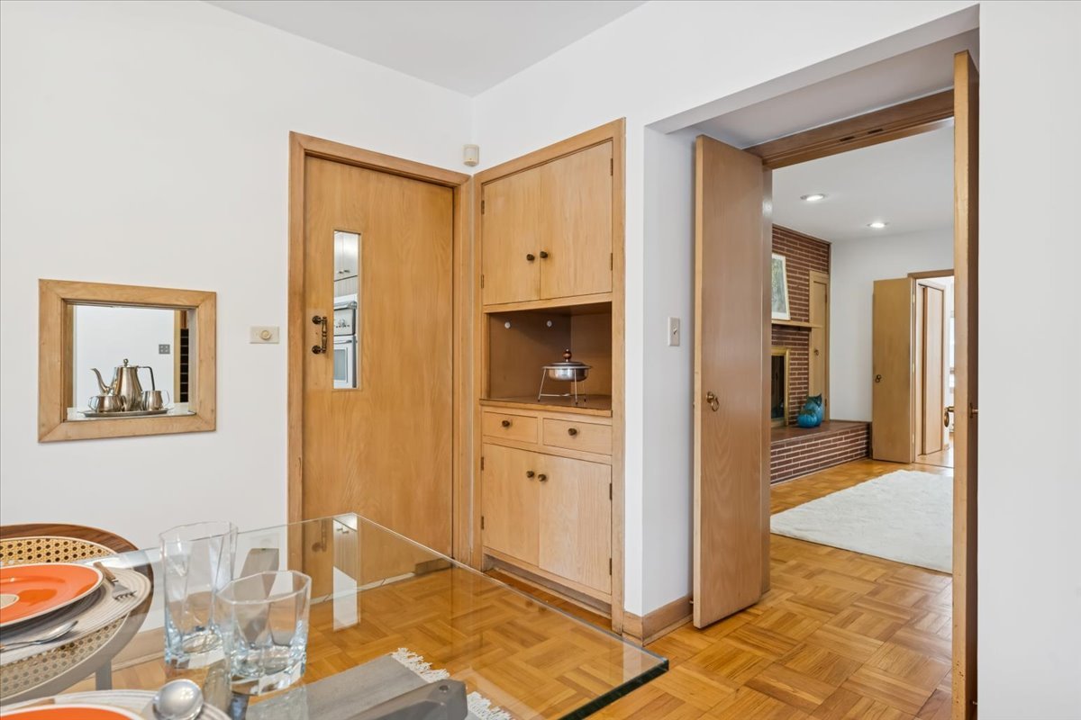 744 Sheridan Road Evanston, IL 60202 - Photo 20 of 44 a view of a hallway with wooden floor and glass door