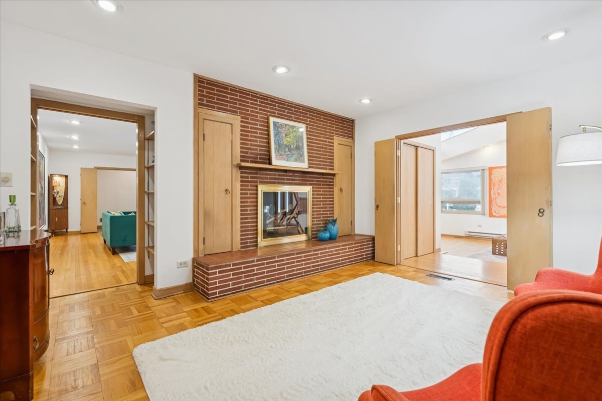 744 Sheridan Road Evanston, IL 60202 - Photo 21 of 44 a view of a livingroom with wooden floor and a large window