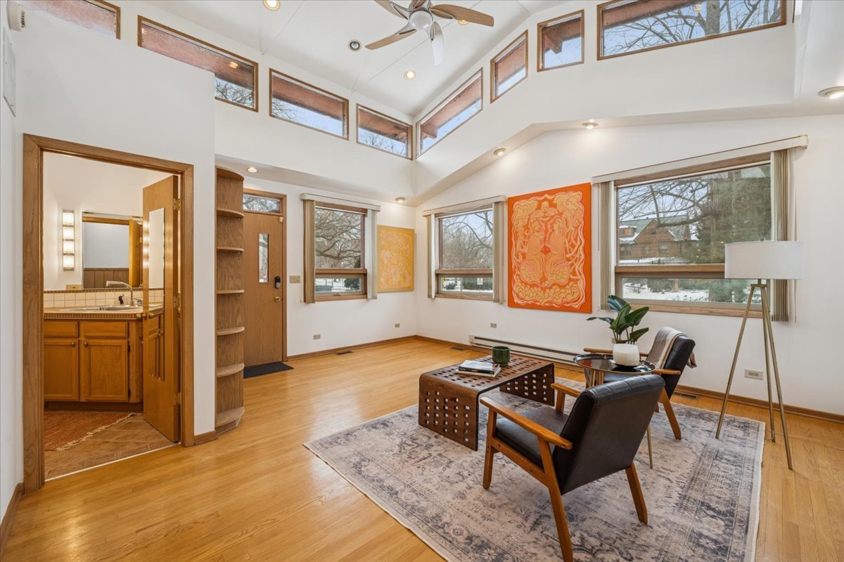744 Sheridan Road Evanston, IL 60202 - Photo 27 of 44 a living room with furniture and large windows