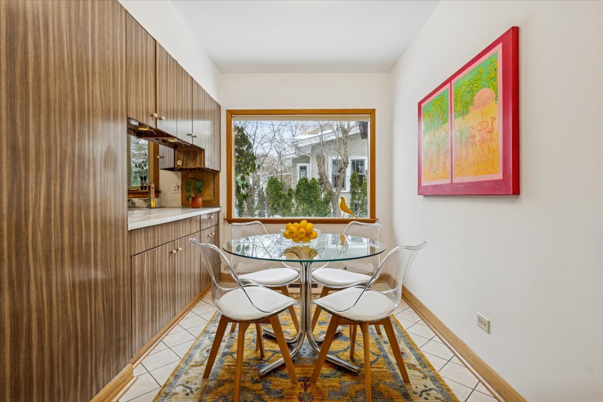 744 Sheridan Road Evanston, IL 60202 - Photo 10 of 44 a view of a dining room with furniture and a window