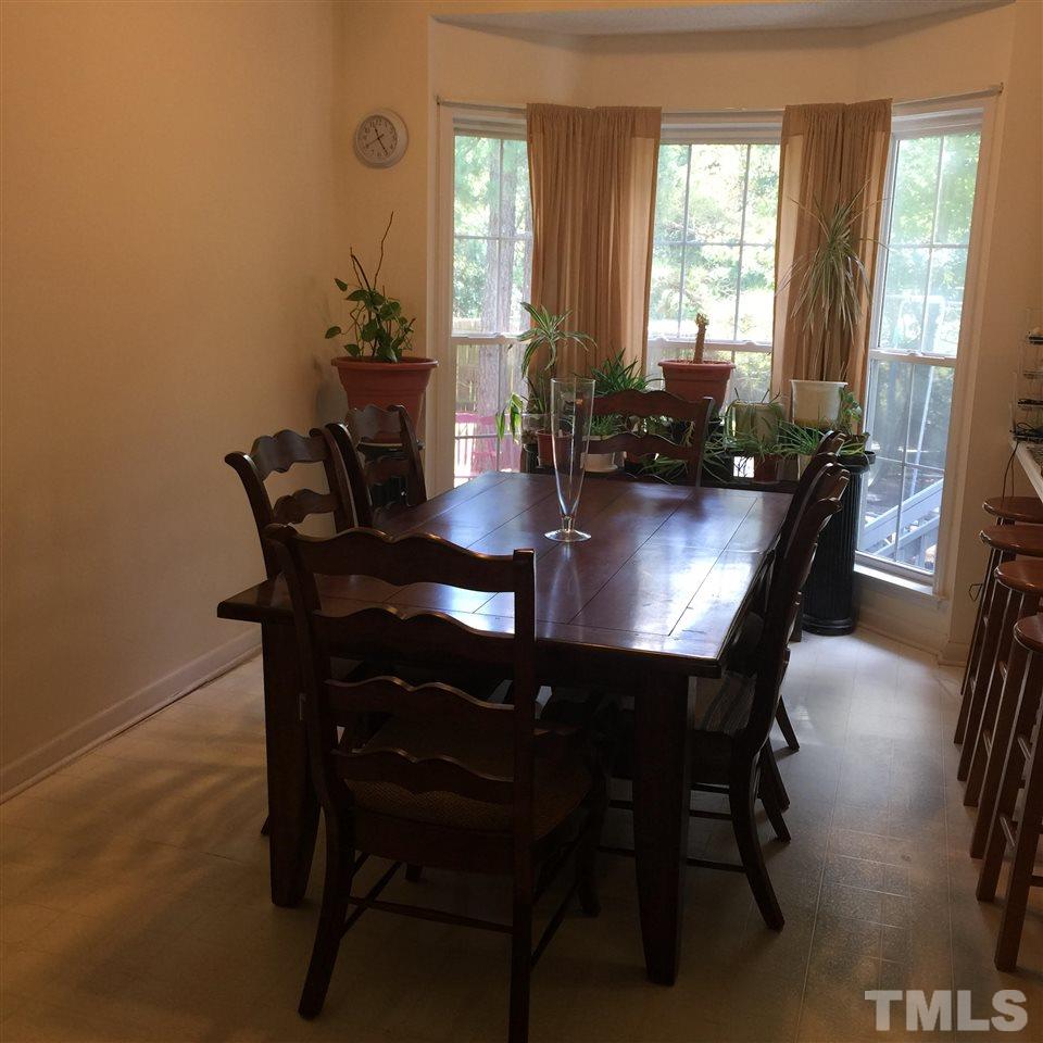 4512 Eider Court Raleigh, NC 27616 - Photo 4 of 8 a view of a dining room with furniture and window