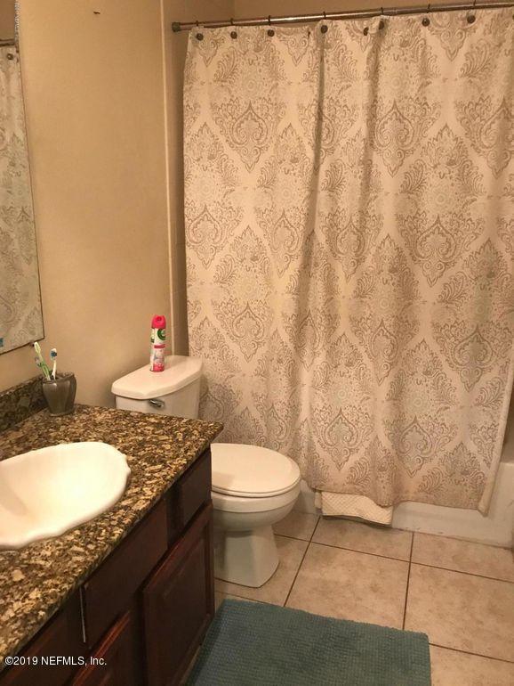 2170 Brooklyn Road Jacksonville, FL 32209 - Photo 2 of 10 a bathroom with a granite countertop sink and a mirror