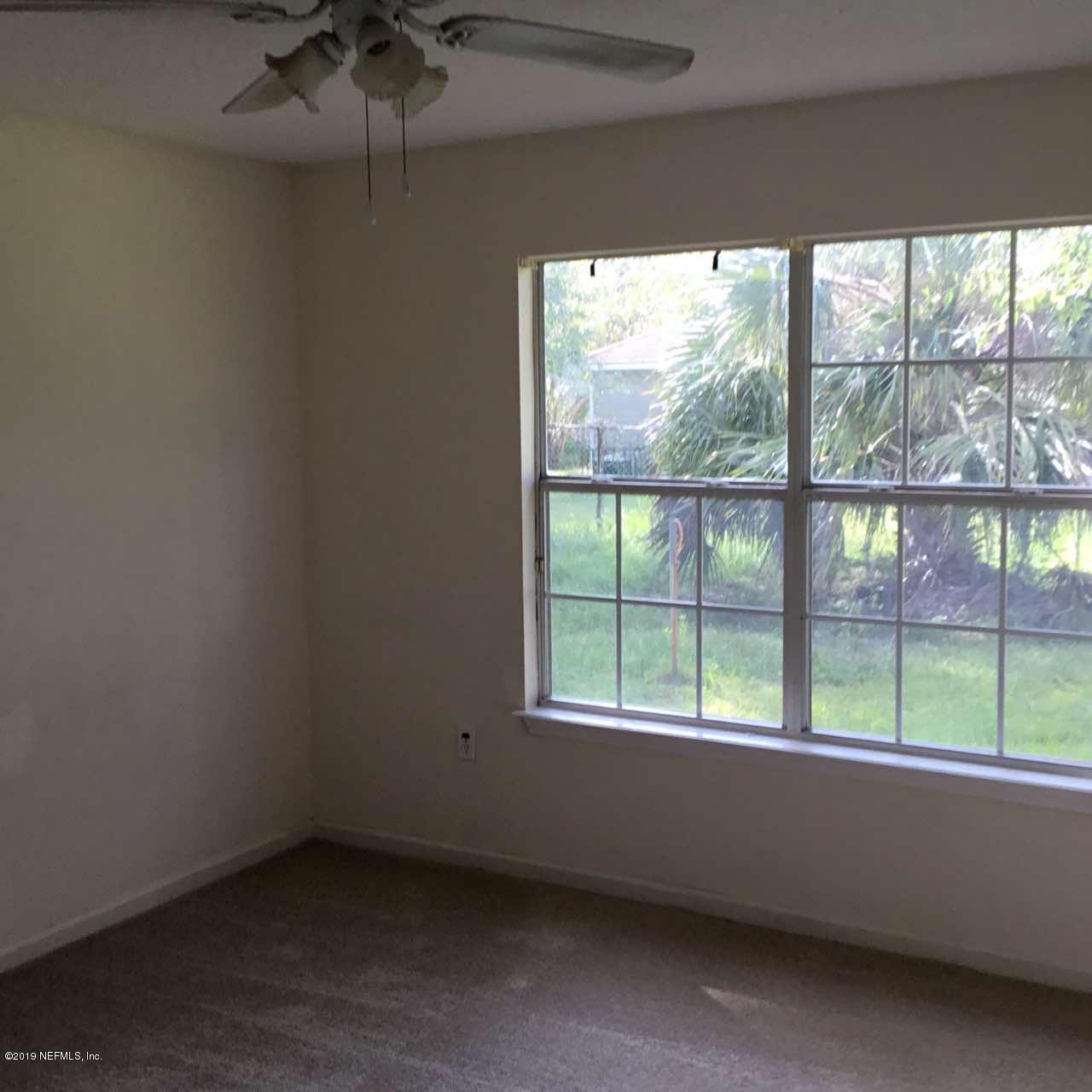 2170 Brooklyn Road Jacksonville, FL 32209 - Photo 6 of 10 an empty room with a window