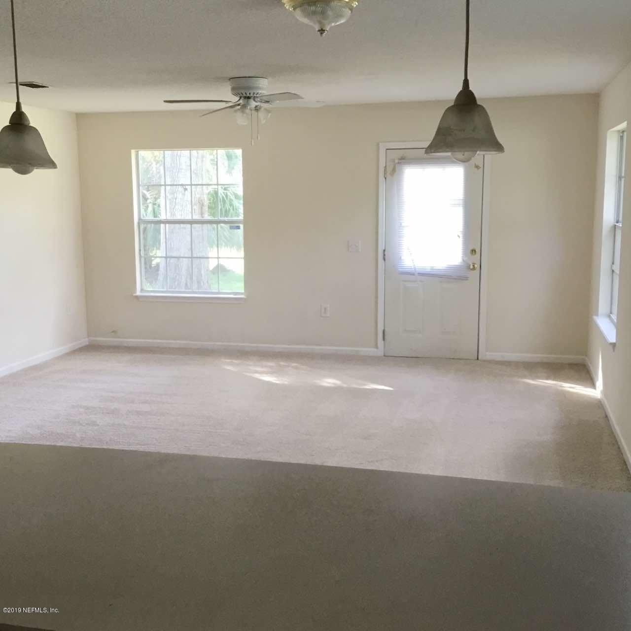 2170 Brooklyn Road Jacksonville, FL 32209 - Photo 10 of 10 an empty room with windows and entrance