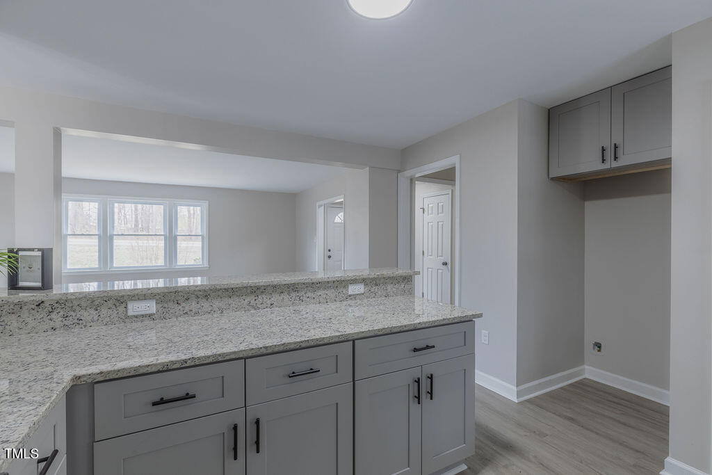 4814 Fayetteville Road Durham, NC 27713 - Photo 11 of 32 a view with granite countertop cabinets and sink