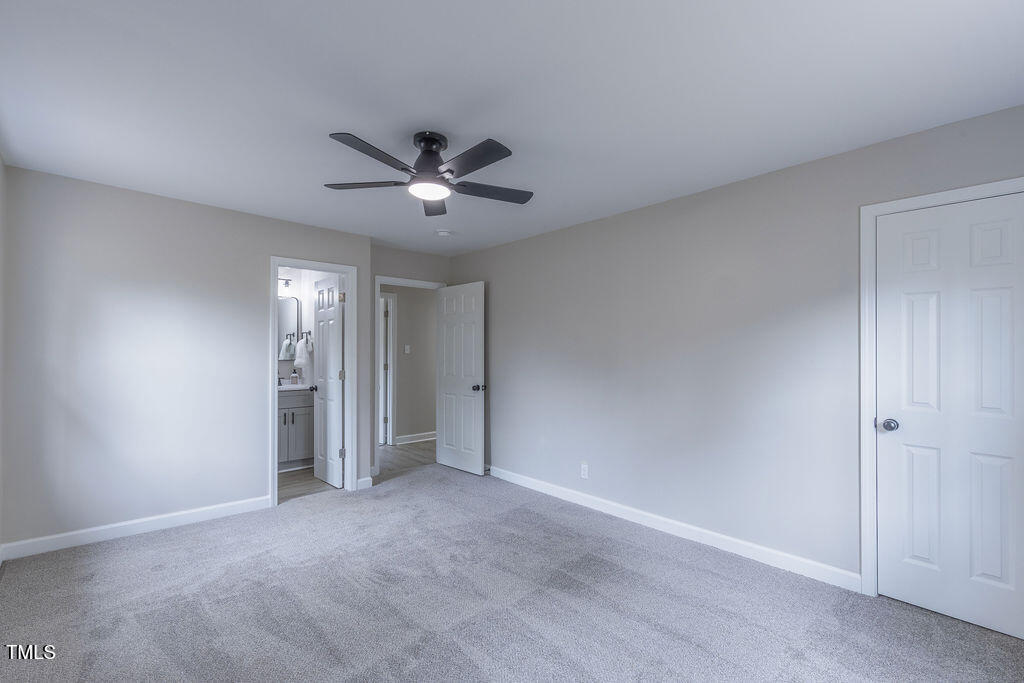 4814 Fayetteville Road Durham, NC 27713 - Photo 23 of 32 a view of an empty room and a ceiling fan