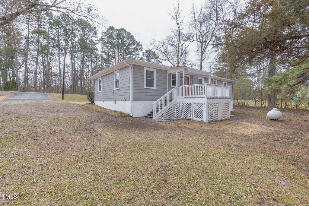 4814 Fayetteville Road Durham, NC 27713 - Photo 27 of 32 a view of a house with a yard and large tree