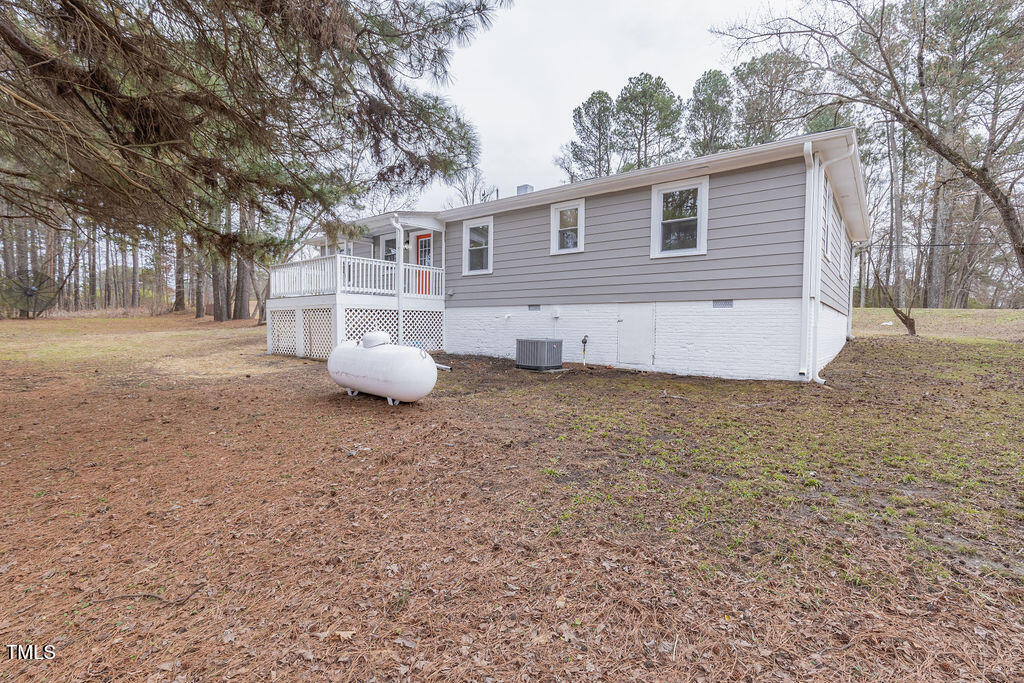 4814 Fayetteville Road Durham, NC 27713 - Photo 28 of 32 a white house that has a tree in front of it