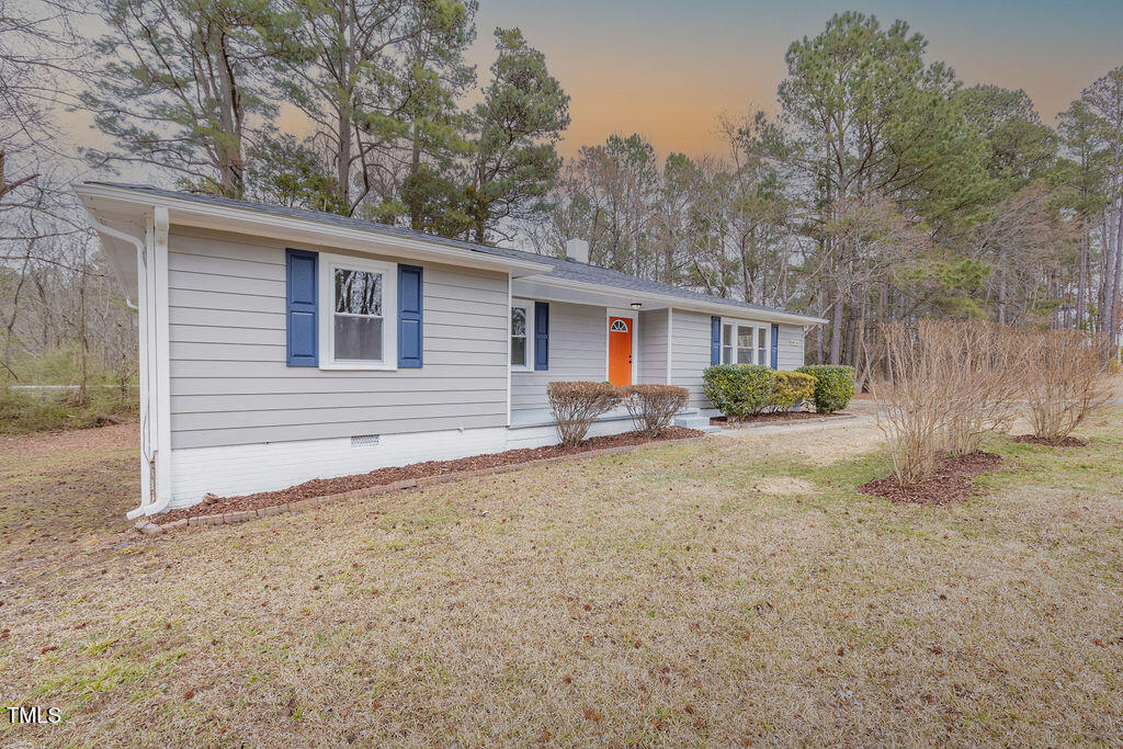4814 Fayetteville Road Durham, NC 27713 - Photo 2 of 32 a front view of a house with a yard and trees