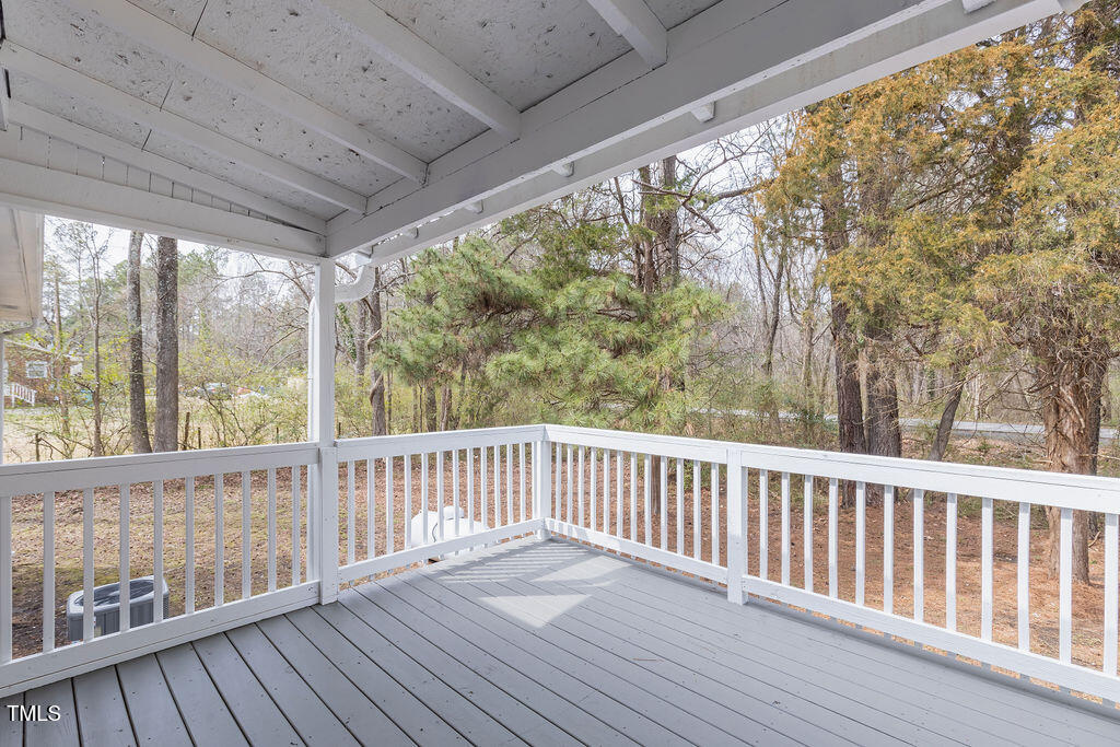 4814 Fayetteville Road Durham, NC 27713 - Photo 30 of 32 a view of balcony with wooden floor