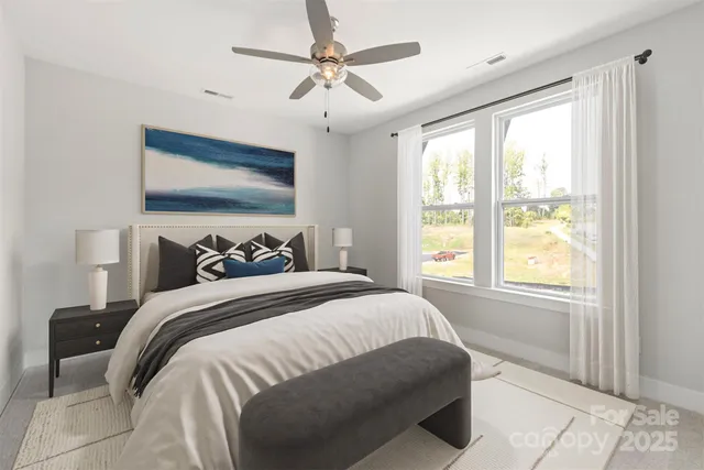 a bedroom with bed and a window