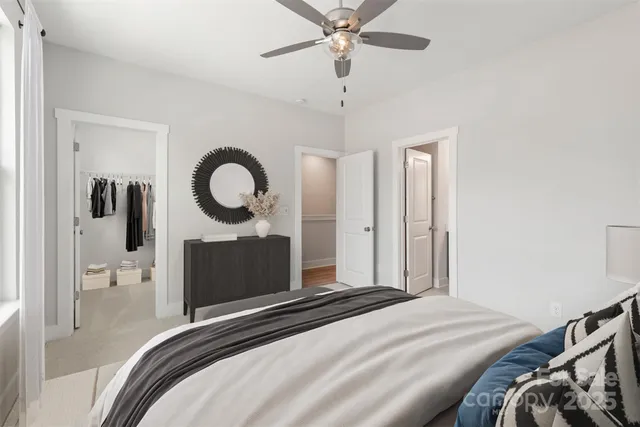 a bedroom with a bed and a mirror