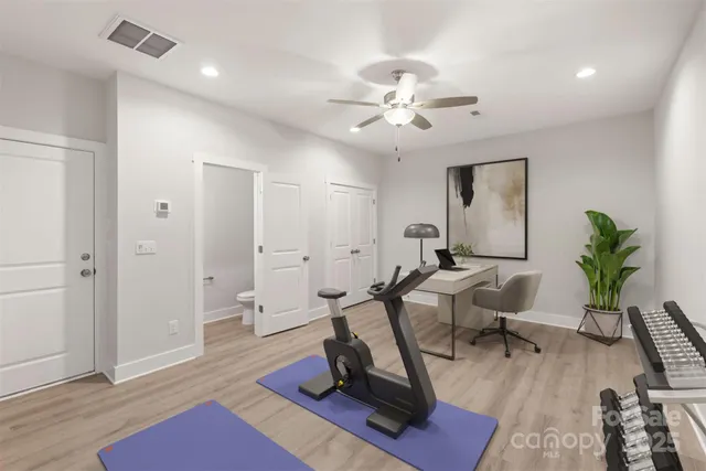 a view of a livingroom with workspace and a couch