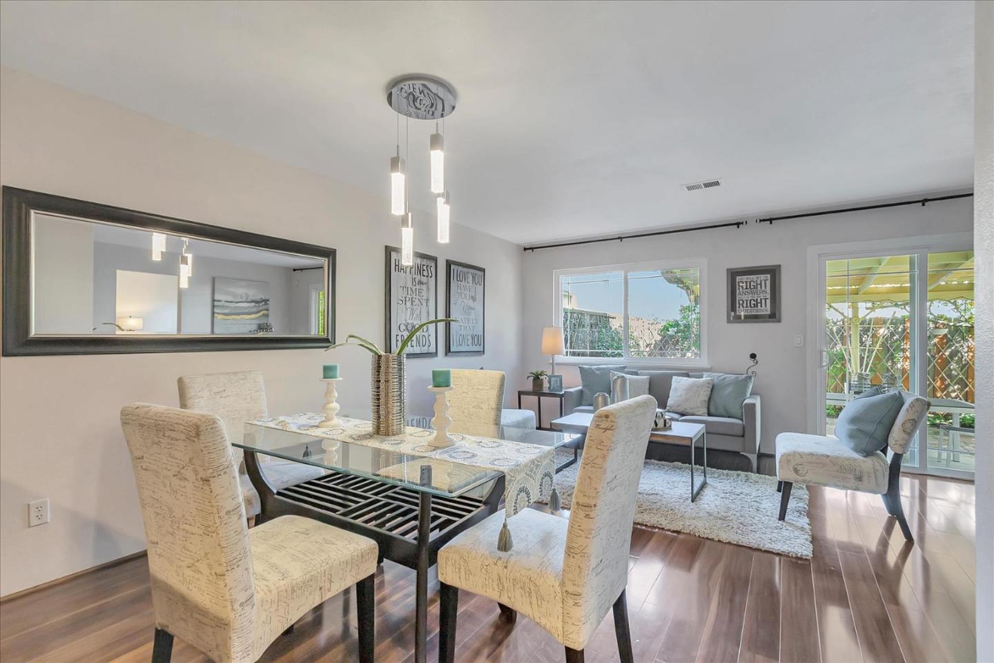 a view of a dining room with furniture window and wooden floor