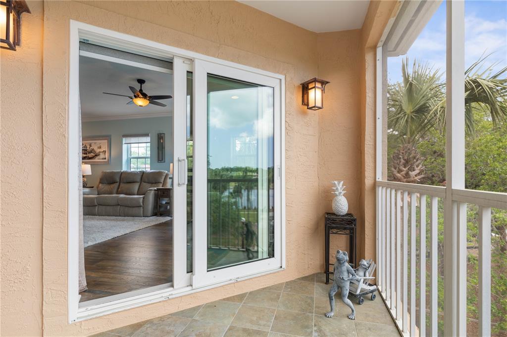 102 Rivers Edge Lane, Unit 102 Palm Coast, FL 32137 - Photo 11 of 67 a view of a hallway with a glass door and a porch