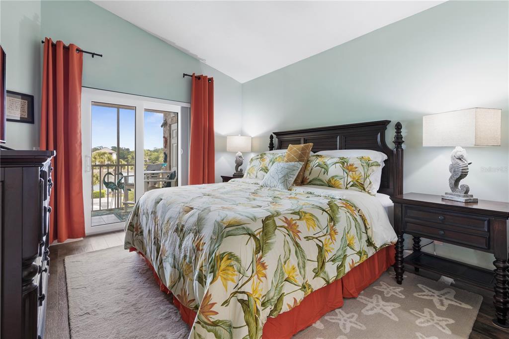 102 Rivers Edge Lane, Unit 102 Palm Coast, FL 32137 - Photo 15 of 67 a bed sitting in a bedroom next to a window