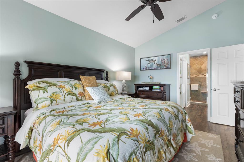 102 Rivers Edge Lane, Unit 102 Palm Coast, FL 32137 - Photo 17 of 67 a bedroom with a bed and painting on the wall
