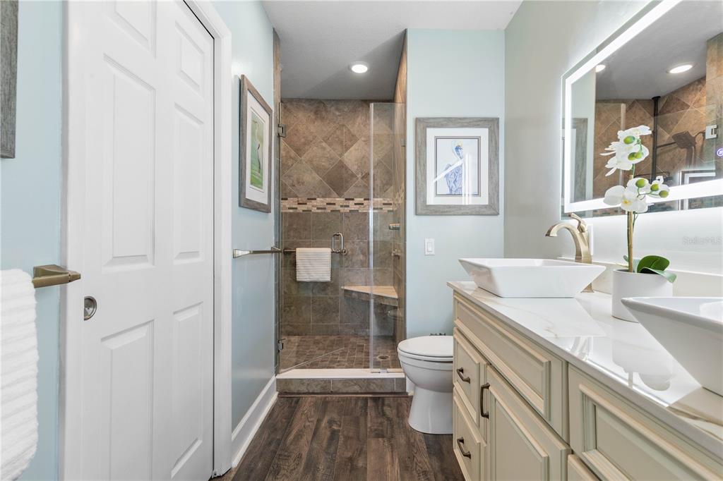 102 Rivers Edge Lane, Unit 102 Palm Coast, FL 32137 - Photo 18 of 67 a bathroom with a sink a toilet and shower