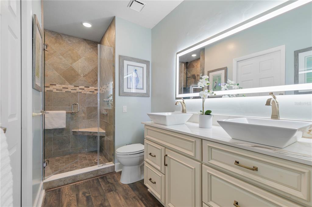 102 Rivers Edge Lane, Unit 102 Palm Coast, FL 32137 - Photo 19 of 67 a bathroom with a sink a toilet and shower