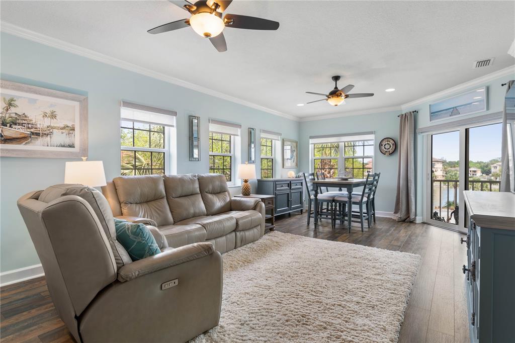 102 Rivers Edge Lane, Unit 102 Palm Coast, FL 32137 - Photo 2 of 67 a living room with furniture and a large window