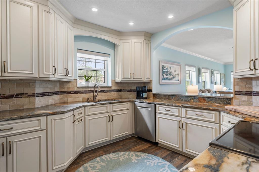 102 Rivers Edge Lane, Unit 102 Palm Coast, FL 32137 - Photo 25 of 67 a kitchen with sink cabinets and window