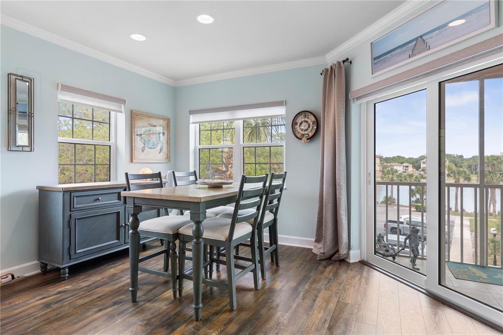 102 Rivers Edge Lane, Unit 102 Palm Coast, FL 32137 - Photo 3 of 67 a view of a dining room with furniture window and wooden floor