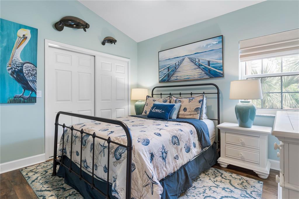 102 Rivers Edge Lane, Unit 102 Palm Coast, FL 32137 - Photo 31 of 67 a bedroom with a bed a couch and dresser