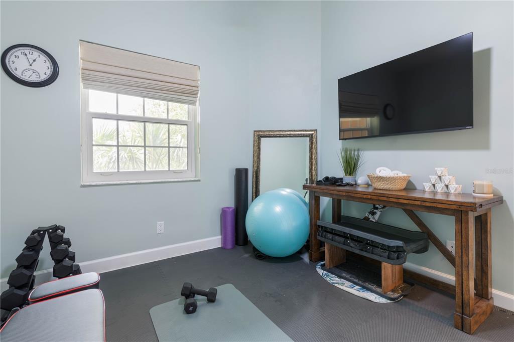 102 Rivers Edge Lane, Unit 102 Palm Coast, FL 32137 - Photo 37 of 67 a living room with furniture and a flat screen tv