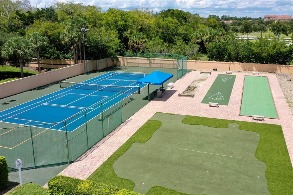 102 Rivers Edge Lane, Unit 102 Palm Coast, FL 32137 - Photo 57 of 67 a view of a tennis ground with large trees