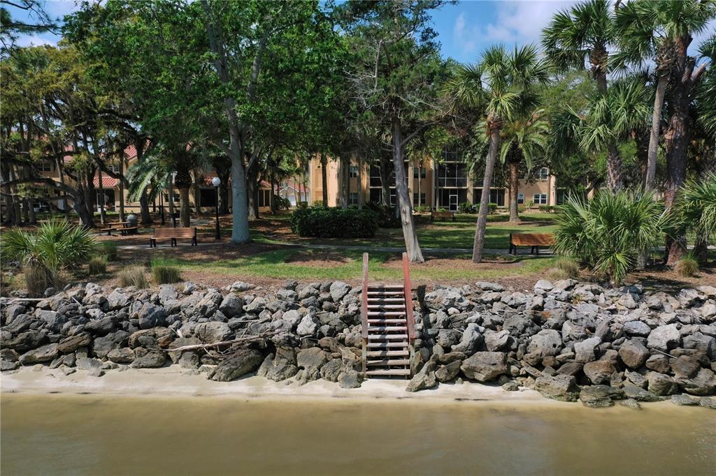 102 Rivers Edge Lane, Unit 102 Palm Coast, FL 32137 - Photo 66 of 67 a view of a wooden door and a yard