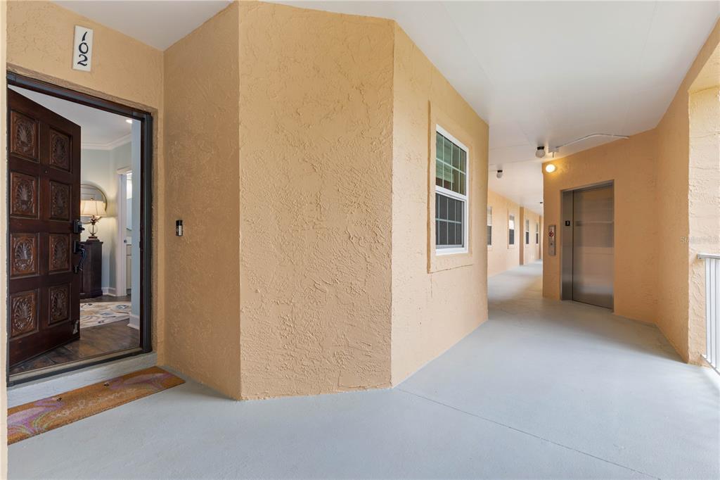 102 Rivers Edge Lane, Unit 102 Palm Coast, FL 32137 - Photo 9 of 67 a view of a hallway with wooden shelves