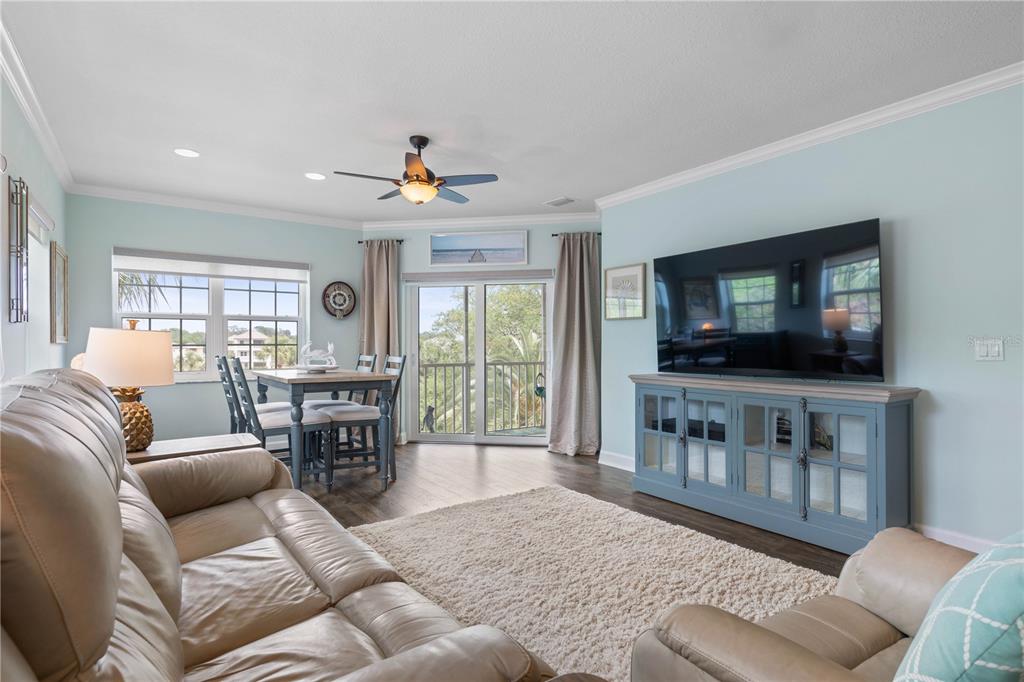 102 Rivers Edge Lane, Unit 102 Palm Coast, FL 32137 - Photo 10 of 67 a living room with furniture and a flat screen tv