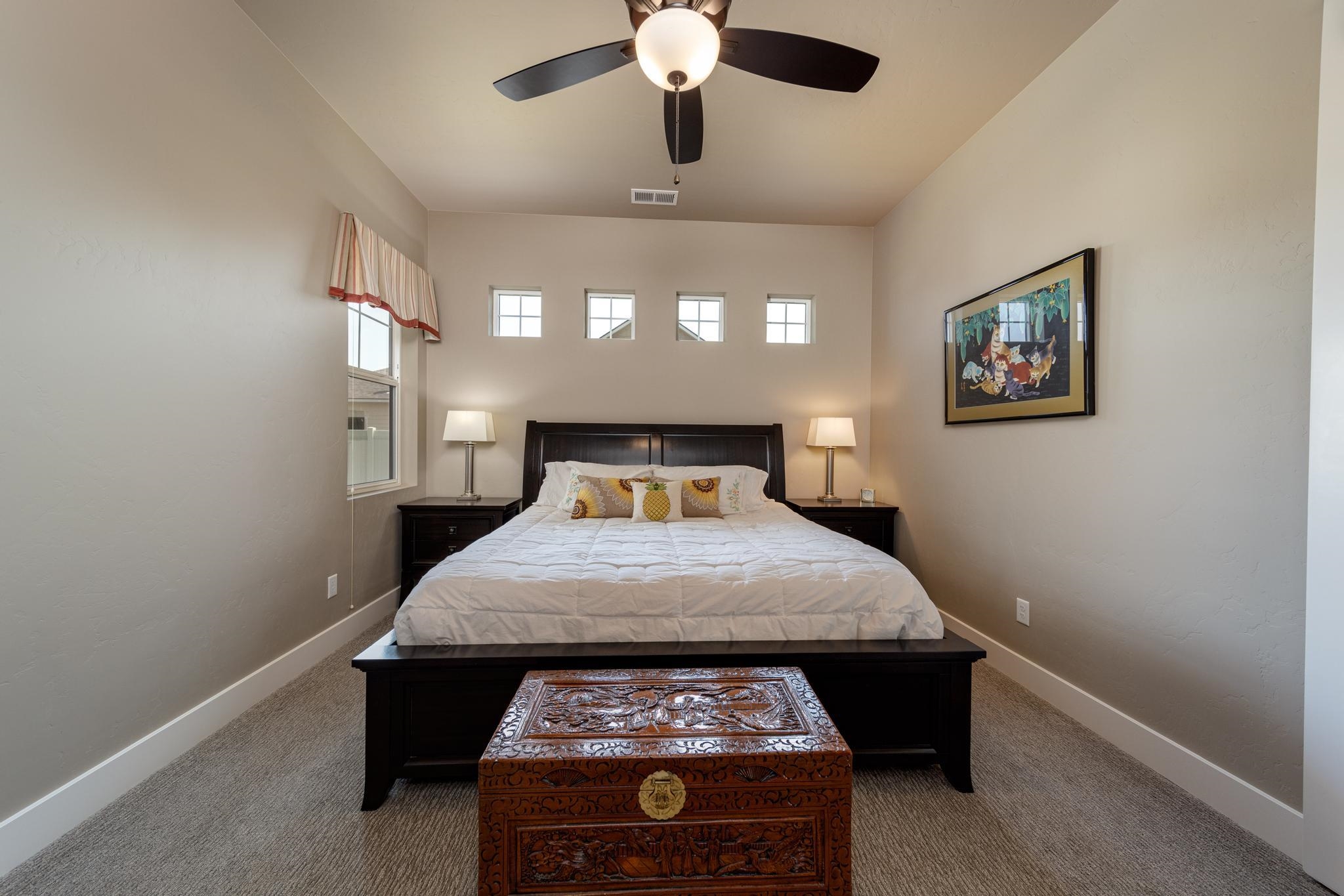 824 Red Apple Road Grand Junction, CO 81505 - Photo 13 of 25 a bed sitting in a room next to a lamp