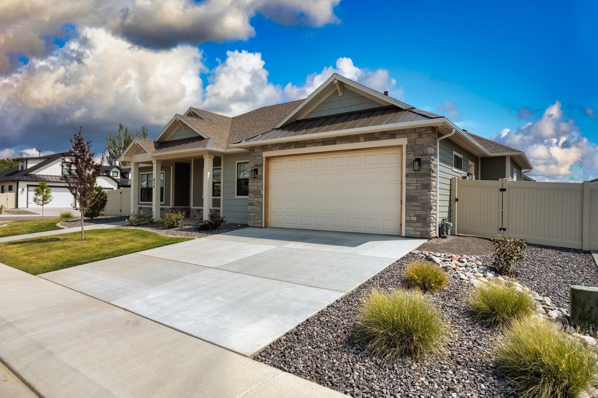 824 Red Apple Road Grand Junction, CO 81505 - Photo 3 of 25 a front view of a house with a yard