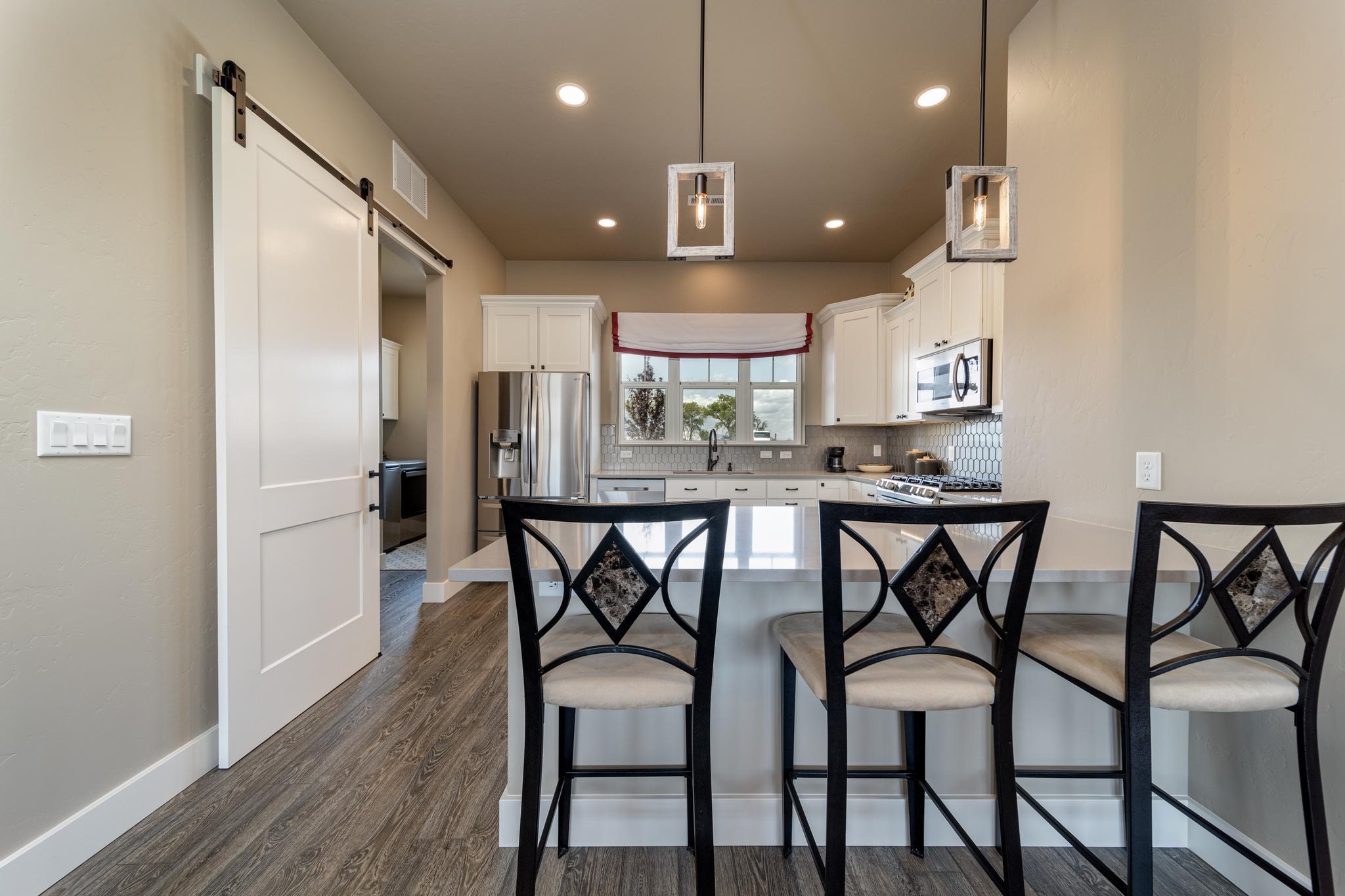 824 Red Apple Road Grand Junction, CO 81505 - Photo 8 of 25 a view of a dining room with furniture and wooden floor