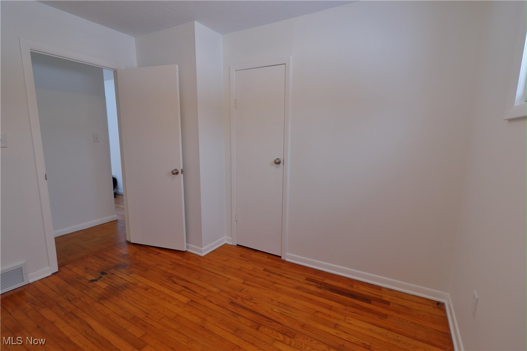 15286 Trask Road Thompson, OH 44086 - Photo 10 of 19 Unfurnished bedroom with hardwood floor