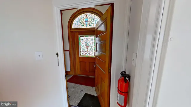 wooden floor in an empty room with a fireplace
