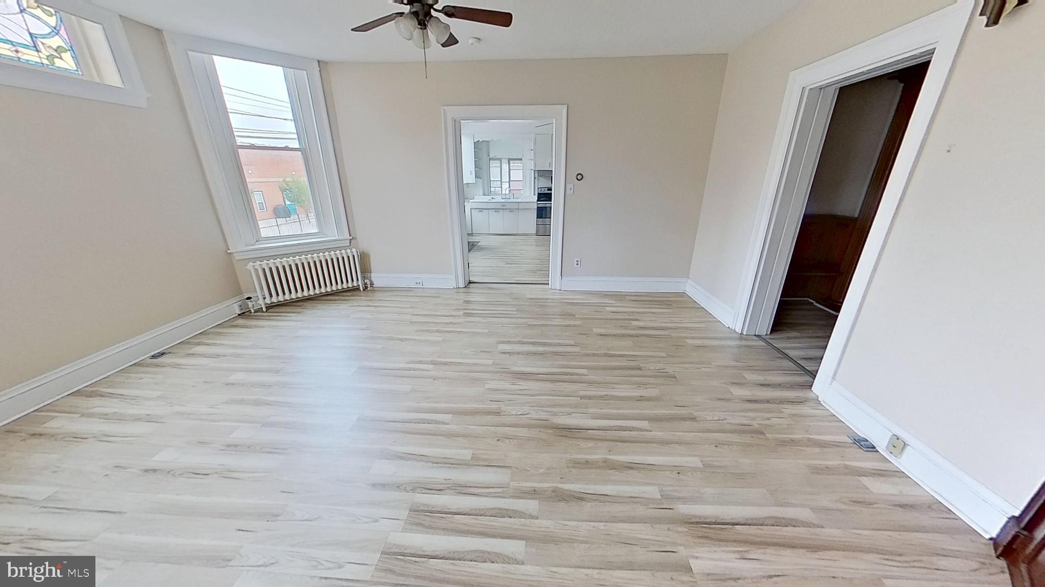 200 Carlisle Street, Unit A Hanover, PA 17331 - Photo 6 of 14 an empty room with windows and closet
