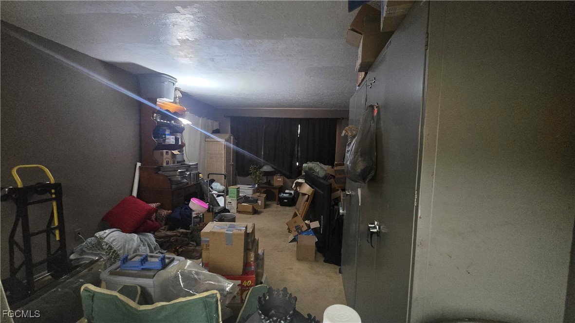 606 Gerald Avenue, Unit 112 Lehigh Acres, FL 33936 - Photo 11 of 17 a view of a room with gym equipment