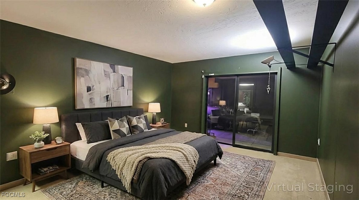 606 Gerald Avenue, Unit 112 Lehigh Acres, FL 33936 - Photo 14 of 17 a bedroom with a bed and a mirror