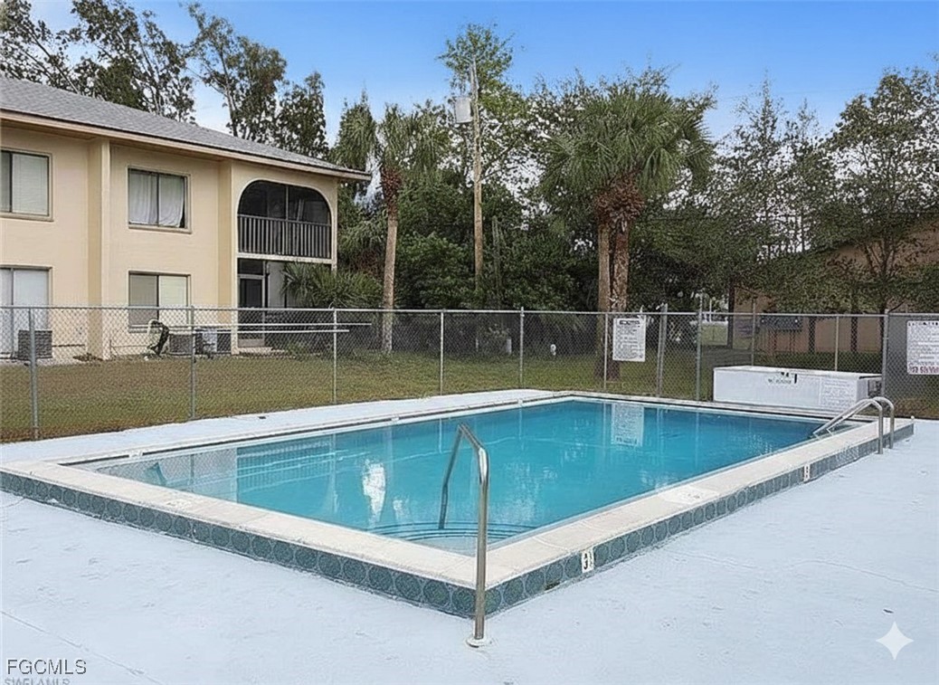 606 Gerald Avenue, Unit 112 Lehigh Acres, FL 33936 - Photo 3 of 17 a view of outdoor space and swimming pool